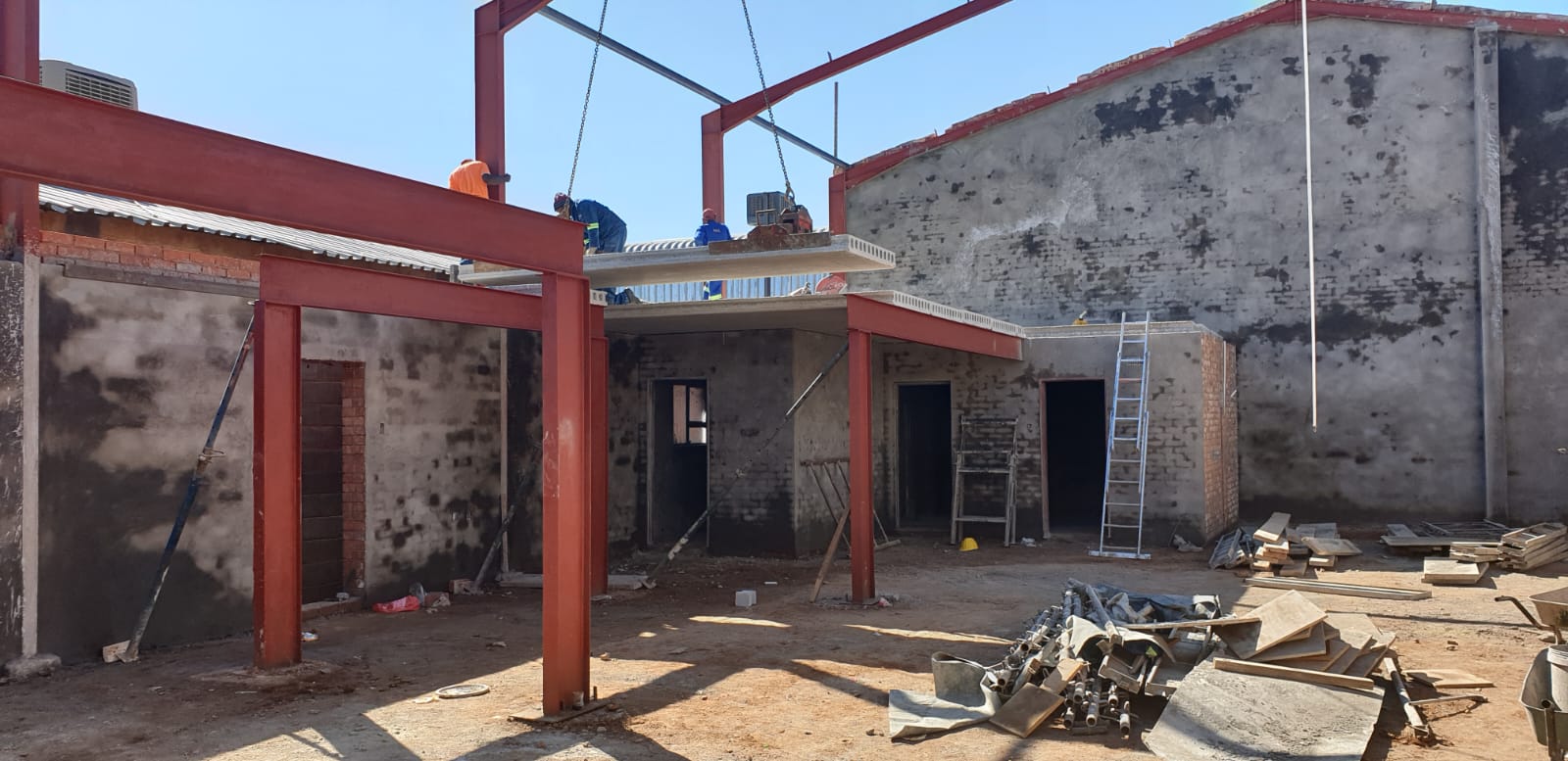 Structural steel erection on an active Aurex construction site